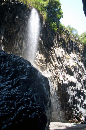 Alcantara river flowing in the unique rock canyon with waterfalls, Sicily, Italyの写真素材