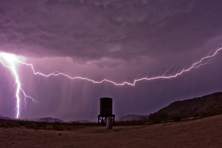 Lightning strikes near an abandoned water tank the the Anza-Borrego Desertの写真素材