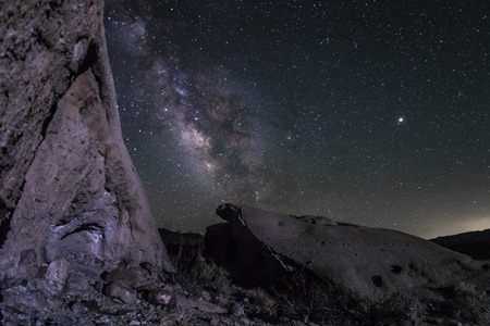 The Milky Way between some sandstone rocks among the Wind Caves in the Anza-Borrego Desert.の写真素材