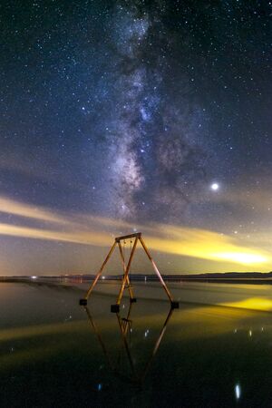 Swingset in the water and the Milky Way at the Salton Seaの写真素材