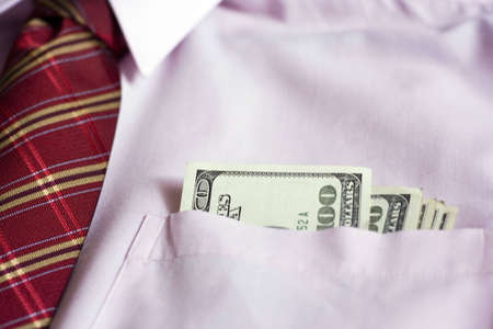 Dollars in the pink shirtの写真素材