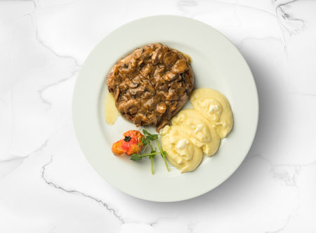 Potatoes with mushrooms Ukrainian cuisine. Photo of food on a white backgroundの写真素材