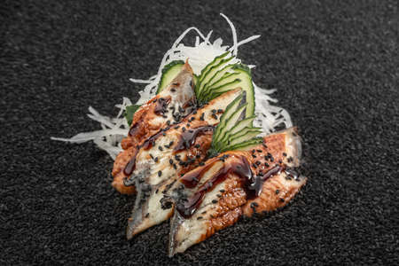 Sushimi eel, Asian cuisine. Photo of food on a dark backgroundの写真素材