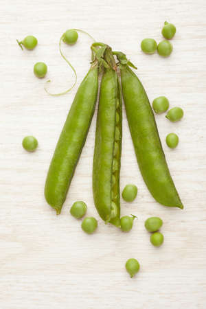 Green peas close up. Photo of food on a light backgroundの写真素材