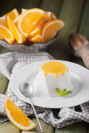 Orange souffle on a white plate, food photography.の写真素材