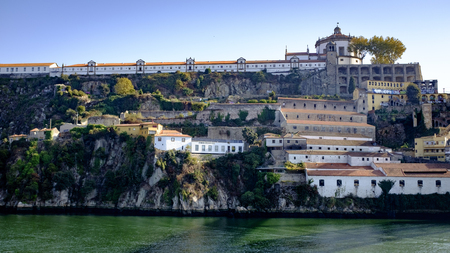 View from the Duoro River of buildings along the riverbank in Porto, Portugalの写真素材