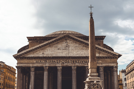 The red granite Egyptian obelisk, St Peters Square in front of the Basilica, Rome, Italyの写真素材