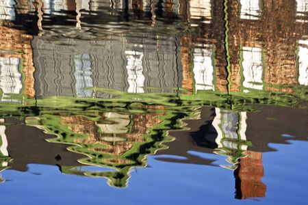 Reflection of  a house in the riverの写真素材