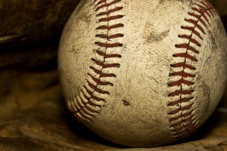 Nostalgic close up of a old baseball that has seen its days.の写真素材