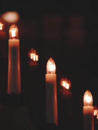 Cristmas electrical candles near the window in the dark. Soft Focus.の写真素材