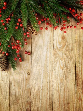 Christmas fir tree with decoration on a wooden boardの写真素材