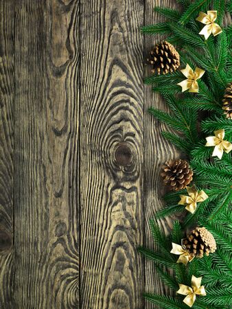 Christmas fir tree with decoration on a wooden boardの写真素材
