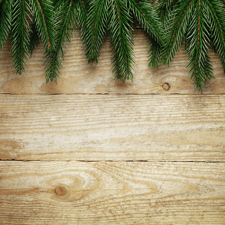 Christmas fir tree with decoration on a wooden board.の写真素材