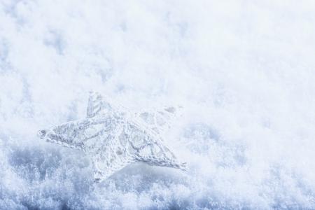 Beautiful magical vintage white star on a white snow background.の写真素材