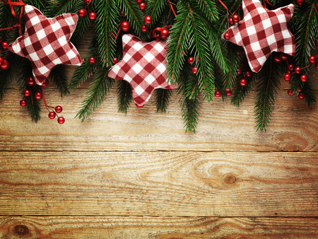Christmas fir tree with decoration on a wooden board.の写真素材