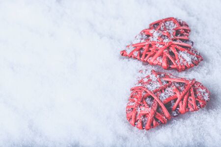 Two beautiful romantic vintage red hearts together on a white snow winter background. Love and St. Valentines Day concept.&amp;amp;#xA;&amp;amp;#xA;の写真素材