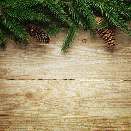 Christmas fir tree with decoration on a wooden board.の写真素材