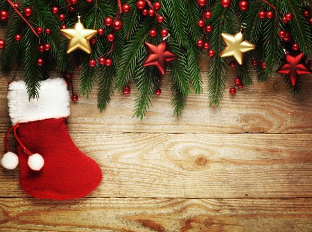 Christmas fir tree with decoration on a wooden board.の写真素材