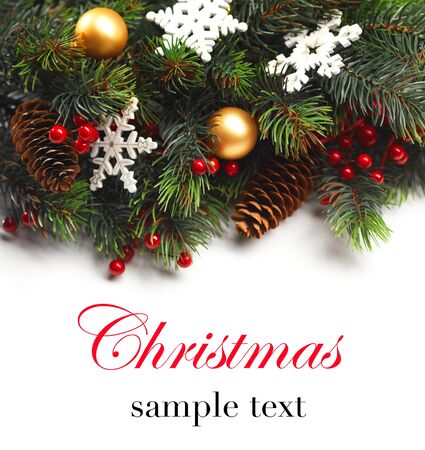 Christmas boarder with fir tree branch with cones and ornament.の写真素材