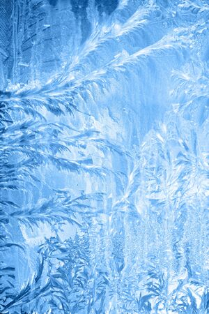 Frosty pattern on window in winter season.の写真素材