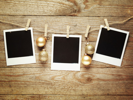 Vintage photo frames decorated for Christmas on the wooden board background with space for your text,の写真素材