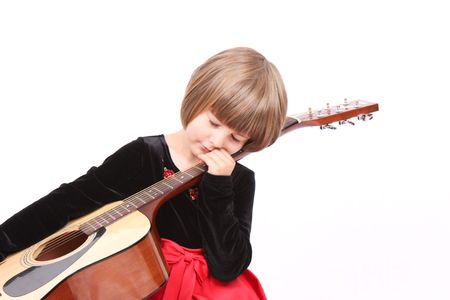 A little girl playing guitarの写真素材