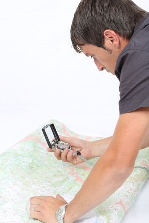 cartographer using compas and GPSの写真素材