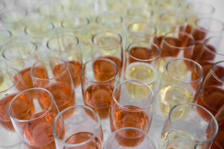 table full with champagne glasses. wite and roseの写真素材
