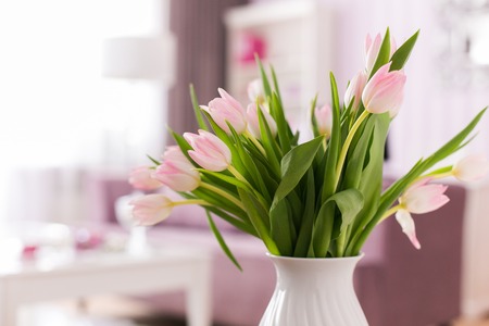 Beautiful fresh pink tulip flowers bouquet. View with copy space. Selective focus. Tulips in interior.の写真素材