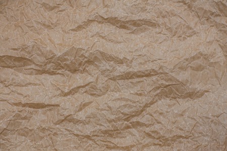 Wrinkled kraft paper. Top view brown crumpled paper background textureの写真素材