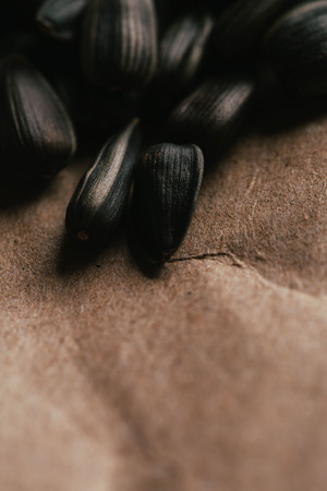 many black sunflower seeds background close up.の写真素材