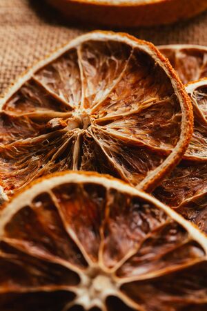 Dried lemon and orange on a light background sacking.の写真素材