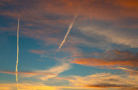 Colorful sunset background with dark and light parts in skyの写真素材