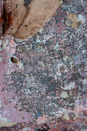 Texture of the old wall with peeling paint. Abstract background for design.