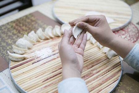 make a dumpling in closeup shot の写真素材