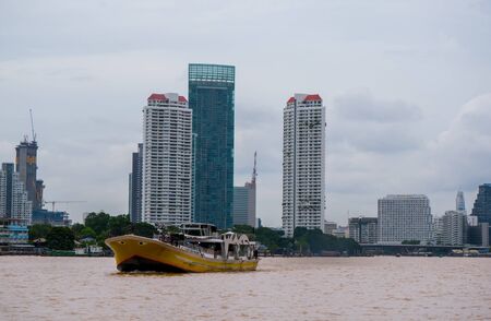 05 Aug 2017 Bangkok,Thailand:Passenger boat and torist at chao praya river and buildingのeditorial素材