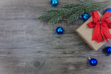 Top view,flat lay gift box and ornament with pine tree branch on grey wooden background copy space Christmas,holiday conceptの写真素材