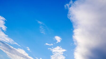 Blue cloudy sky in winter timeの写真素材