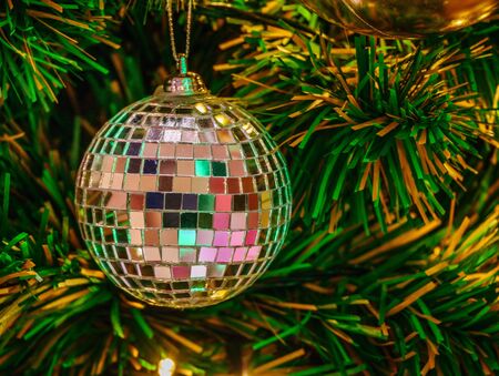 Sparkle golden Christmas ornament and golden light on pine tree Christmas,holiday,festive conceptの写真素材