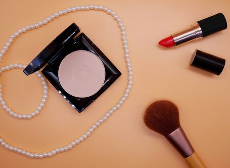 Flat lay cosmetics and brushes on orange background;Beauty,cosmetics conceptの写真素材