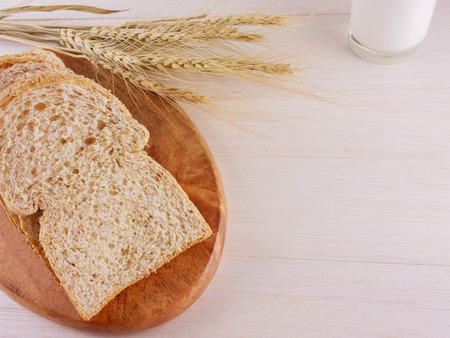 Flat lay,top view  breads on wooden plate and wooden background  bakery,food,concept