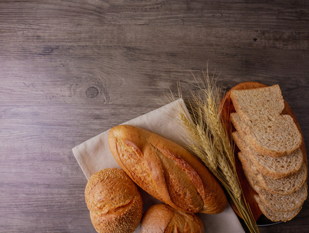 Flat lay various of breads on wooden background  Bakery,food conceptの写真素材