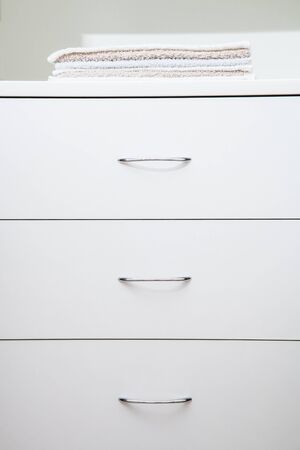 Fragment of a home wardrobe with towelsの写真素材