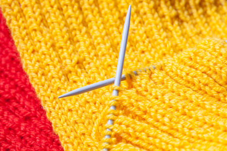 Fragment of a hand knitting , closeup shotの写真素材