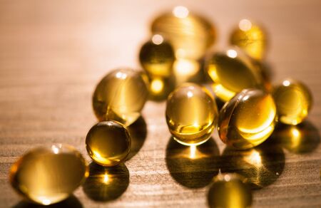 Capsules of a vitamin E and fish fat - closeup shotの写真素材