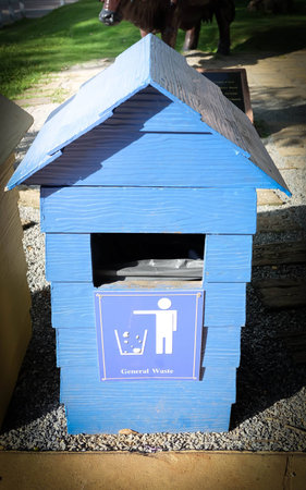 Blue garbage trash bins in the gardenの写真素材