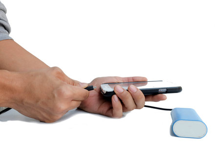 Hand man is holding smart -phone with power blank on white backgroundの写真素材