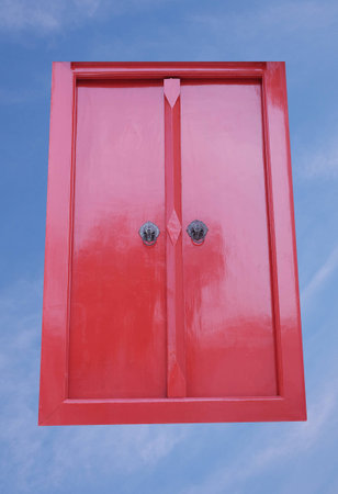 red door on sky backgroundの写真素材