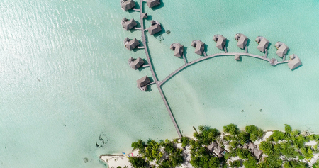 Water bungalows resort at islands, french polynesia in aerial viewの写真素材