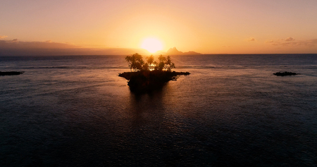 sunset on an islet in French Polynesiaの写真素材